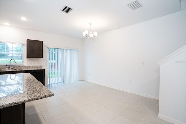 3850 Hampstead Ln, Lakeland, FL 33810 - unfurnished dining area with a chandelier, recessed lighting, and light tile patterned floors