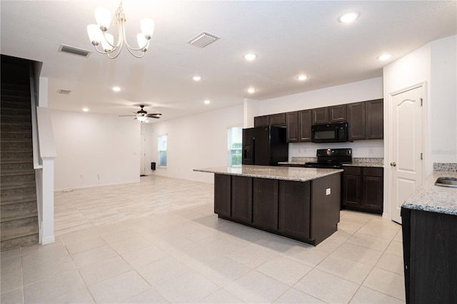 3850 Hampstead Ln, Lakeland, FL 33810 - kitchen featuring black appliances, a chandelier, a kitchen island, light tile patterned floors, and recessed lighting
