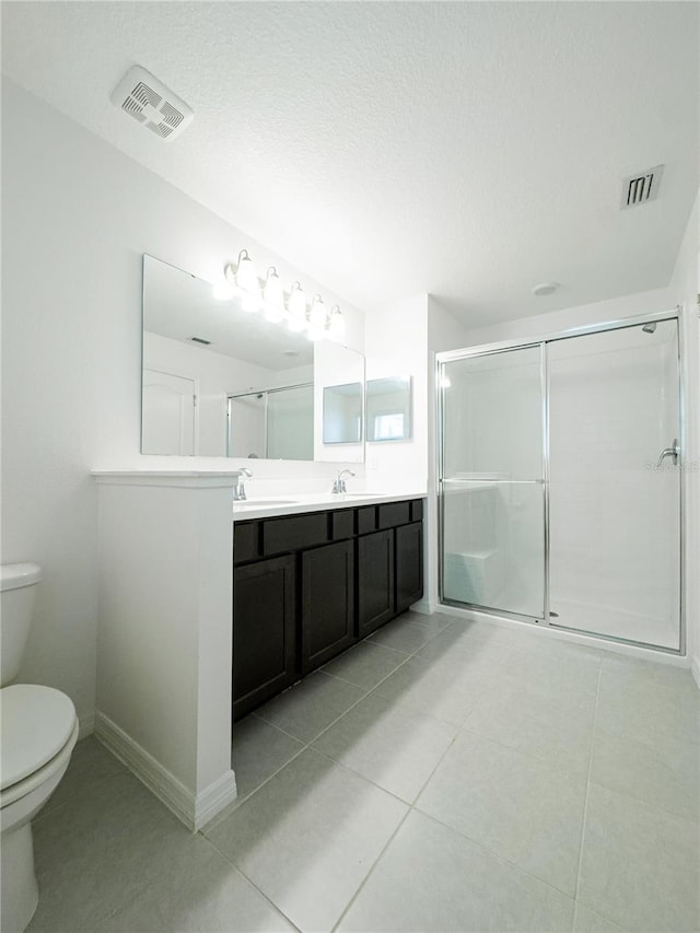 3850 Hampstead Ln, Lakeland, FL 33810 - bathroom featuring double vanity, a stall shower, and tile patterned floors