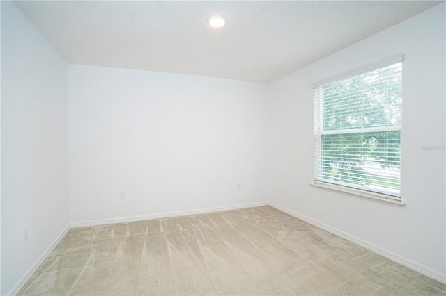 3850 Hampstead Ln, Lakeland, FL 33810 - spare room featuring light colored carpet and baseboards