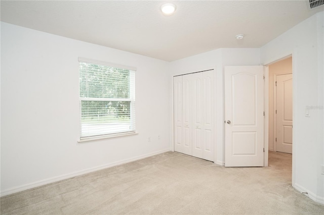 3850 Hampstead Ln, Lakeland, FL 33810 - unfurnished bedroom featuring light colored carpet and a closet