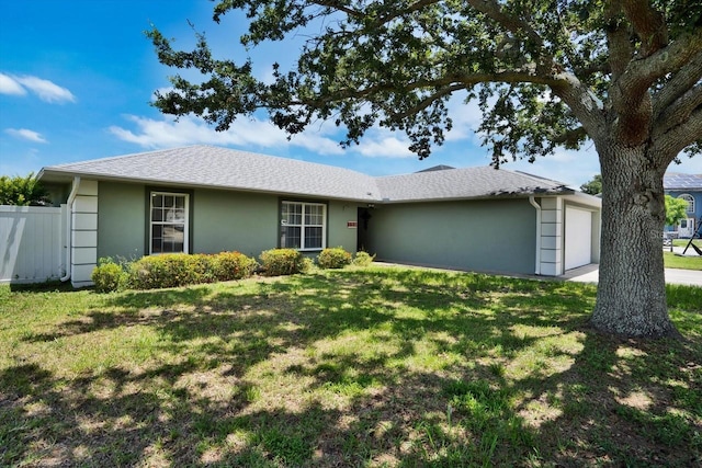 130 Evergreen Dr, Auburndale, FL 33823 - ranch-style house with stucco siding and a garage
