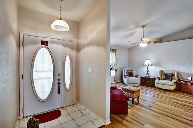 130 Evergreen Dr, Auburndale, FL 33823 - foyer entrance with ceiling fan and light wood finished floors