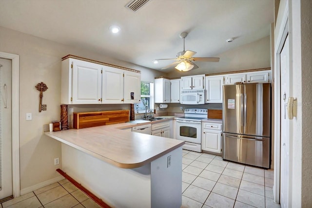 130 Evergreen Dr, Auburndale, FL 33823 - kitchen featuring white appliances, a peninsula, light tile patterned floors, white cabinetry, and ceiling fan