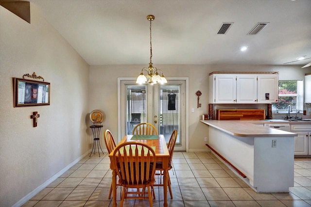 130 Evergreen Dr, Auburndale, FL 33823 - dining area with a chandelier and light tile patterned floors