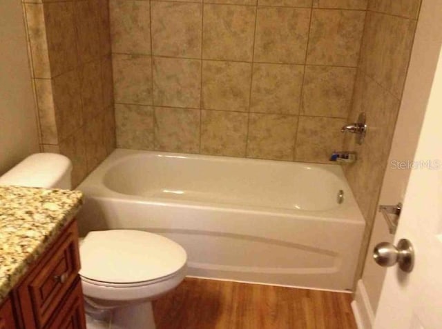 301 NW 8th St, Gainesville, FL 32601 - full bath with wood finished floors, vanity, and bathing tub / shower combination