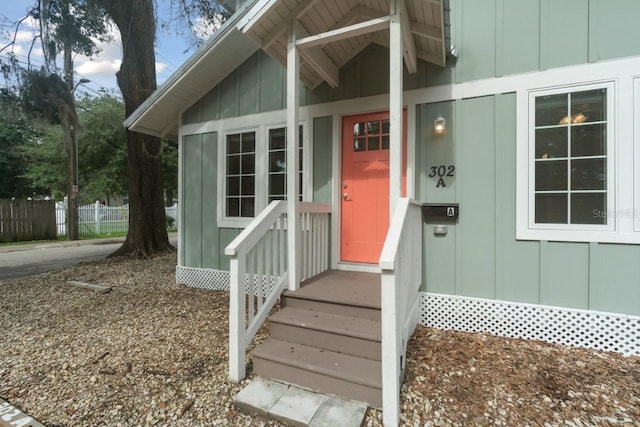 302 NW 7th Ter, Gainesville, FL 32601 - view of exterior entry featuring board and batten siding
