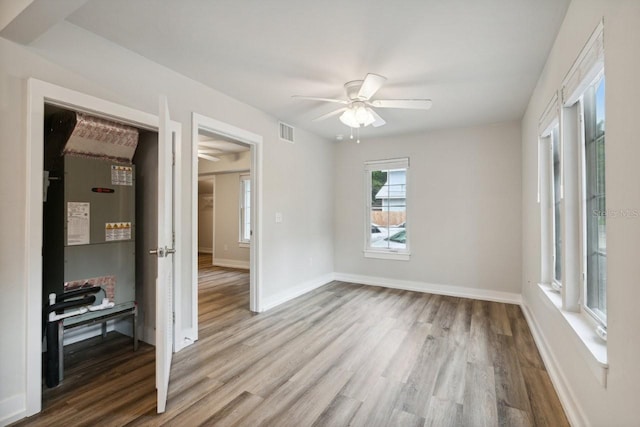 302 NW 7th Ter, Gainesville, FL 32601 - empty room featuring ceiling fan and wood finished floors