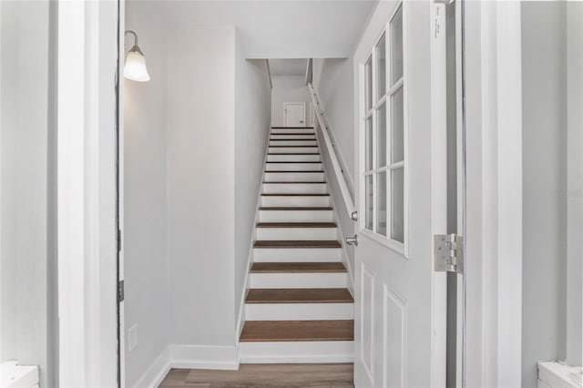 302 NW 7th Ter, Gainesville, FL 32601 - stairway featuring wood finished floors and baseboards