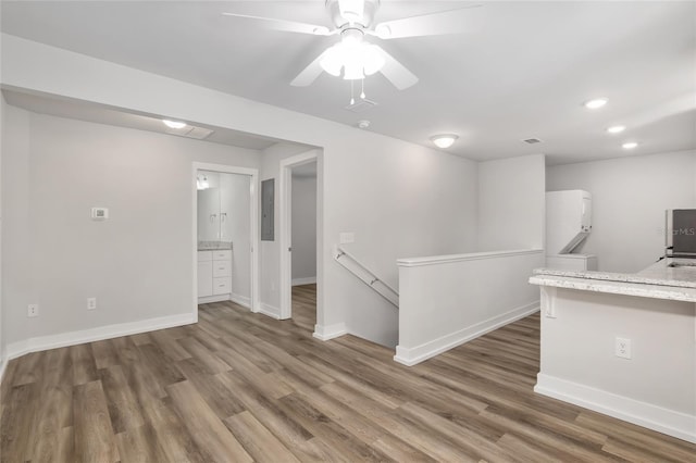 302 NW 7th Ter, Gainesville, FL 32601 - spare room with wood finished floors, washer / clothes dryer, ceiling fan, recessed lighting, and electric panel