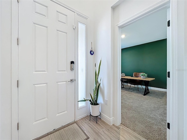 2044 Keystone Pass Blvd, Minneola, FL 34715 - foyer entrance with light carpet and light wood-style floors