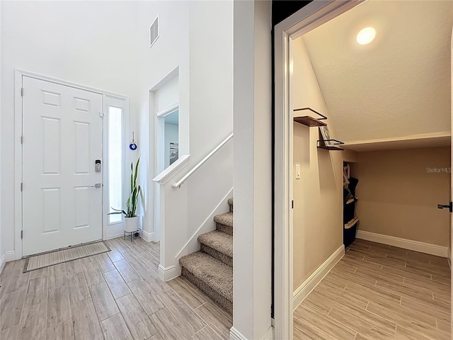 2044 Keystone Pass Blvd, Minneola, FL 34715 - entrance foyer with light wood-style floors and stairway