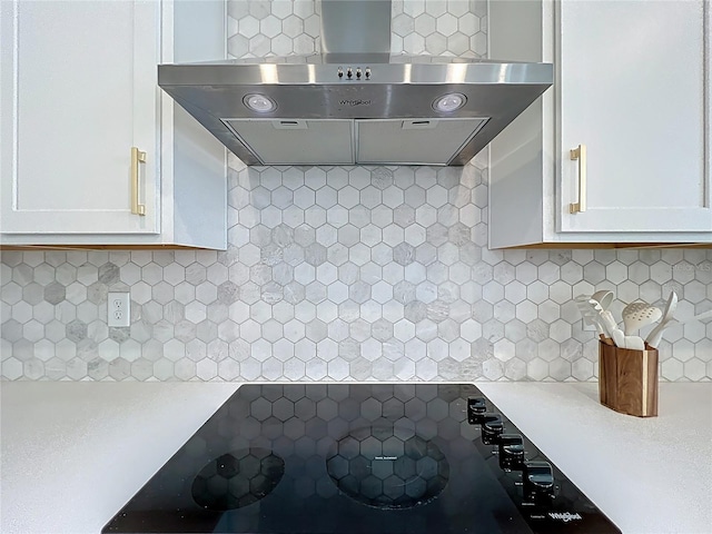 2044 Keystone Pass Blvd, Minneola, FL 34715 - kitchen with extractor fan, white cabinetry, backsplash, and light countertops
