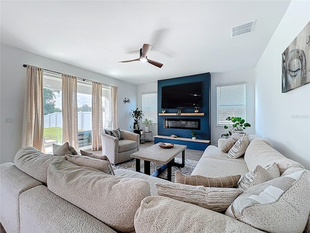 2044 Keystone Pass Blvd, Minneola, FL 34715 - living area featuring a ceiling fan and wood finished floors