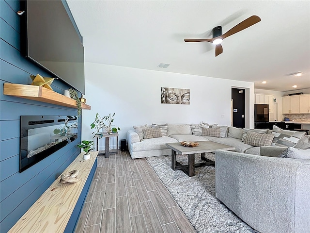2044 Keystone Pass Blvd, Minneola, FL 34715 - living room featuring light wood finished floors, a ceiling fan, and recessed lighting