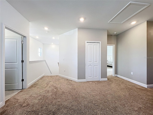 2044 Keystone Pass Blvd, Minneola, FL 34715 - carpeted spare room featuring attic access and recessed lighting