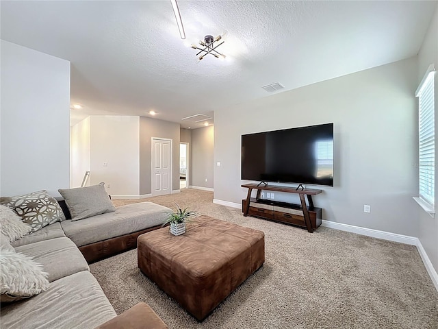 2044 Keystone Pass Blvd, Minneola, FL 34715 - living room featuring light colored carpet, a textured ceiling, and plenty of natural light