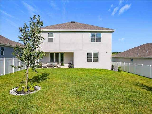 2044 Keystone Pass Blvd, Minneola, FL 34715 - back of house featuring an outdoor living space, stucco siding, a fenced backyard, a patio area, and a shingled roof