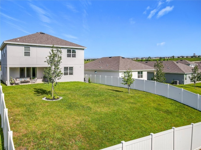 2044 Keystone Pass Blvd, Minneola, FL 34715 - fenced backyard with outdoor lounge area, a patio, and a residential view