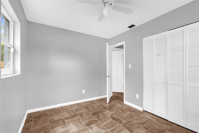 5390 Botany Ct, Orlando, FL 32811 - unfurnished bedroom with a closet and a ceiling fan