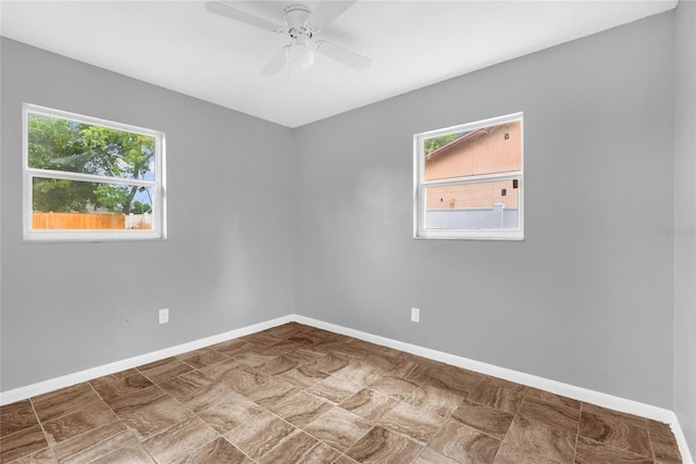 5390 Botany Ct, Orlando, FL 32811 - spare room with healthy amount of natural light and a ceiling fan