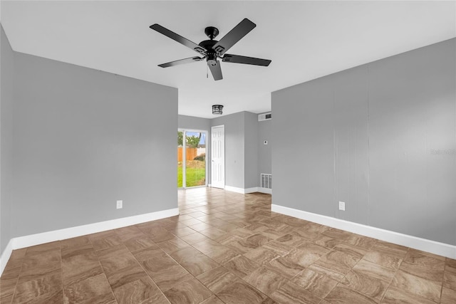5390 Botany Ct, Orlando, FL 32811 - empty room with a ceiling fan and baseboards
