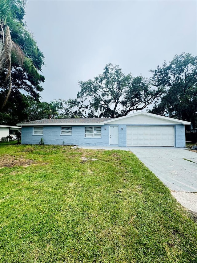 4934 Avery Rd, New Port Richey, FL 34652 - single story home featuring driveway, a front yard, and a garage