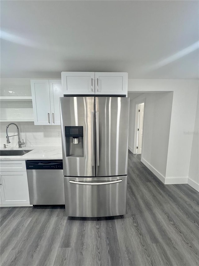 4934 Avery Rd, New Port Richey, FL 34652 - kitchen featuring appliances with stainless steel finishes, open shelves, dark wood-type flooring, white cabinets, and light countertops