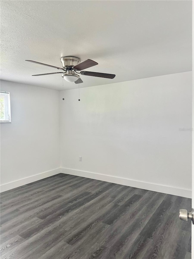 4934 Avery Rd, New Port Richey, FL 34652 - empty room featuring ceiling fan, dark wood finished floors, and a textured ceiling