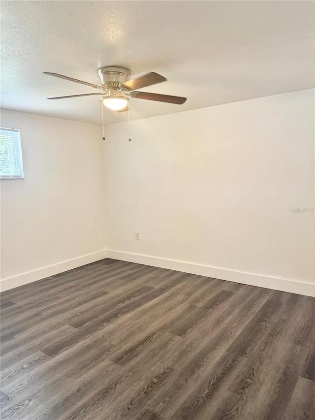 4934 Avery Rd, New Port Richey, FL 34652 - spare room featuring ceiling fan, dark wood-style flooring, and a textured ceiling