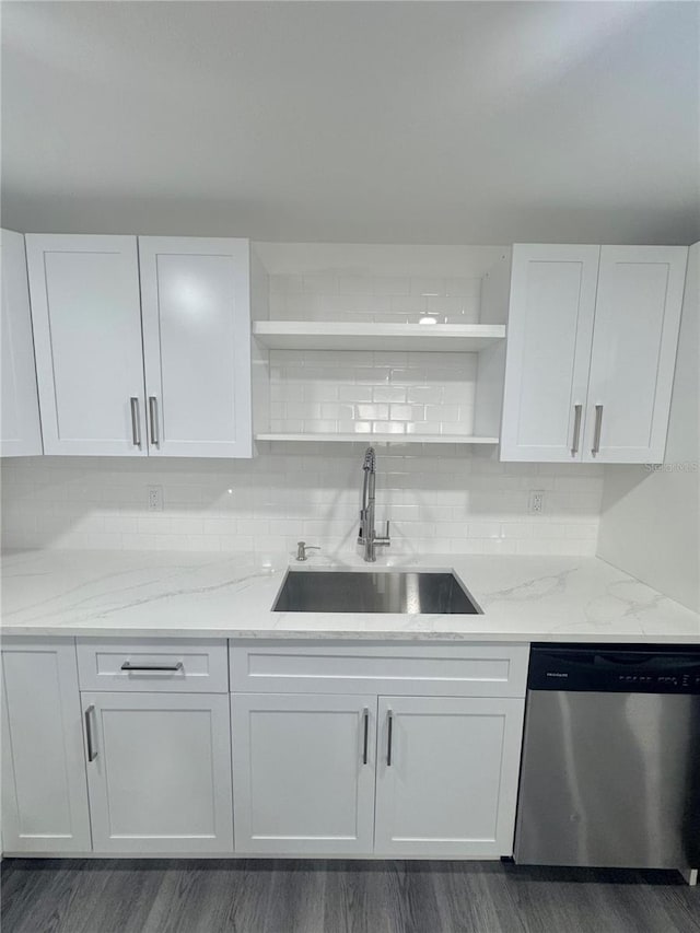 4934 Avery Rd, New Port Richey, FL 34652 - kitchen with stainless steel dishwasher, open shelves, white cabinetry, and light stone countertops