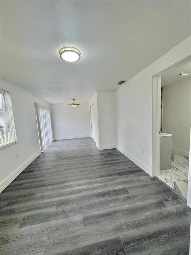 4934 Avery Rd, New Port Richey, FL 34652 - empty room featuring ceiling fan and dark wood finished floors
