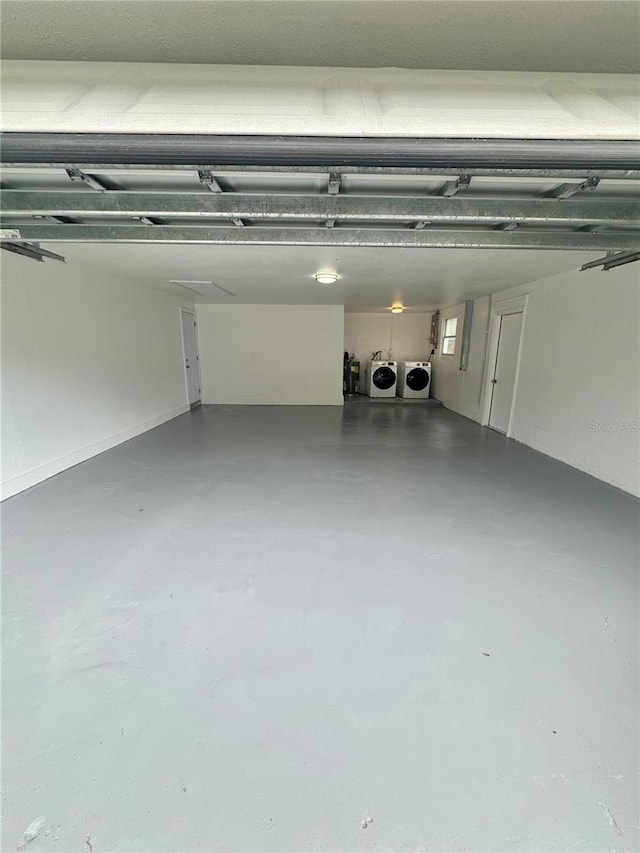 4934 Avery Rd, New Port Richey, FL 34652 - garage featuring washer and clothes dryer