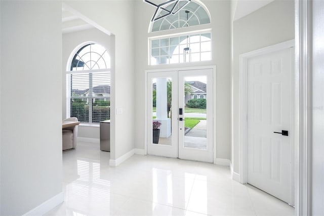 9844 Montclair Cir, Apopka, FL 32703 - entryway featuring french doors, a high ceiling, and light tile patterned floors