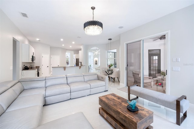 9844 Montclair Cir, Apopka, FL 32703 - living room with a chandelier, recessed lighting, and light tile patterned floors