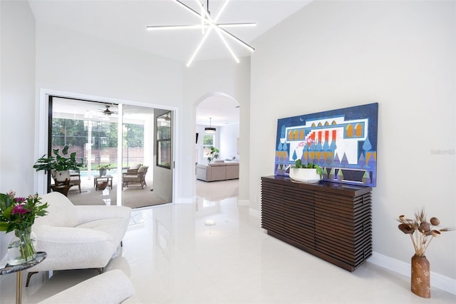 9844 Montclair Cir, Apopka, FL 32703 - living room featuring arched walkways, healthy amount of natural light, tile patterned flooring, and high vaulted ceiling