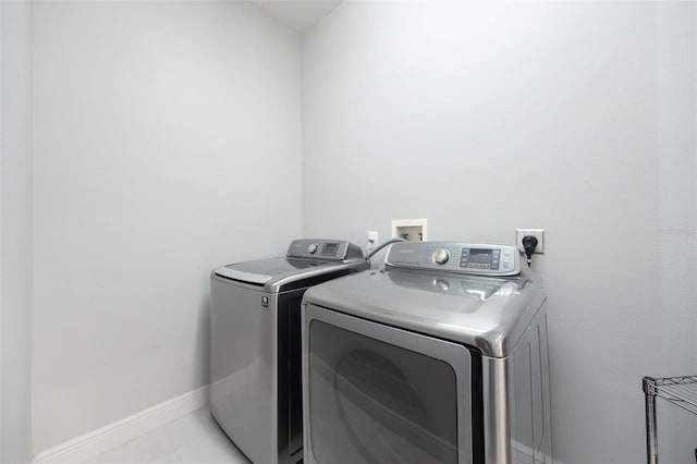 9844 Montclair Cir, Apopka, FL 32703 - washroom featuring separate washer and dryer and baseboards