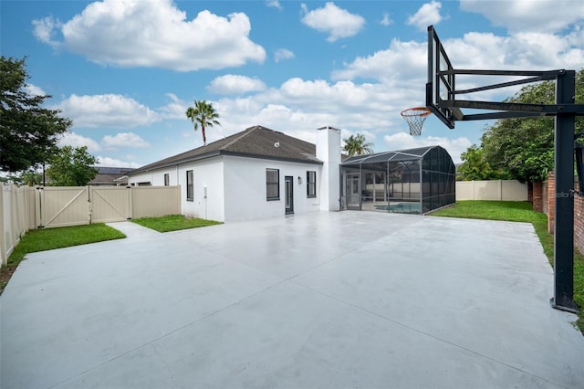 9844 Montclair Cir, Apopka, FL 32703 - back of house featuring a gate, a fenced backyard, stucco siding, and a patio area