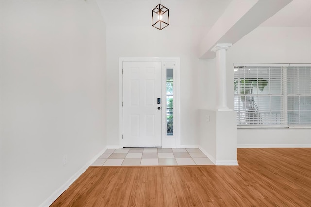 11442 Beggs Ct, Clermont, FL 34711 - foyer entrance featuring ornate columns and wood finished floors