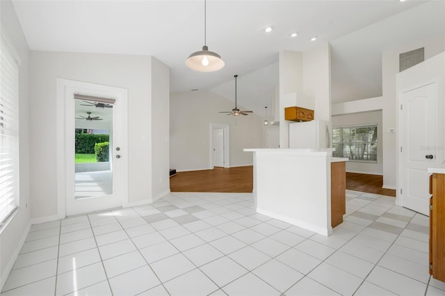 11442 Beggs Ct, Clermont, FL 34711 - kitchen with freestanding refrigerator, ceiling fan, light countertops, decorative light fixtures, and open floor plan