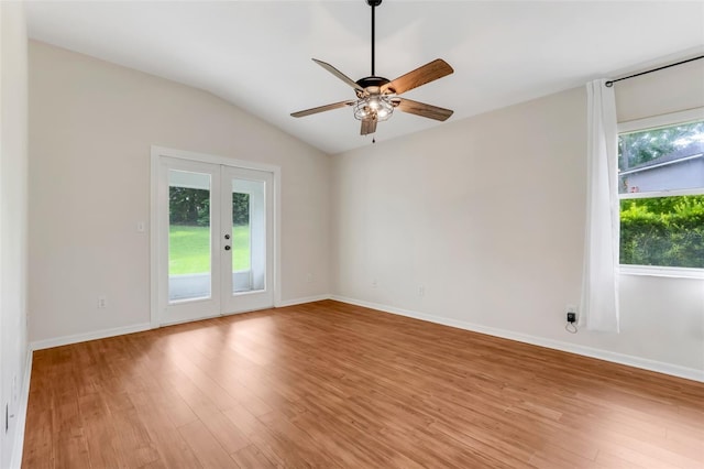 11442 Beggs Ct, Clermont, FL 34711 - empty room with light wood-style floors, french doors, ceiling fan, and lofted ceiling
