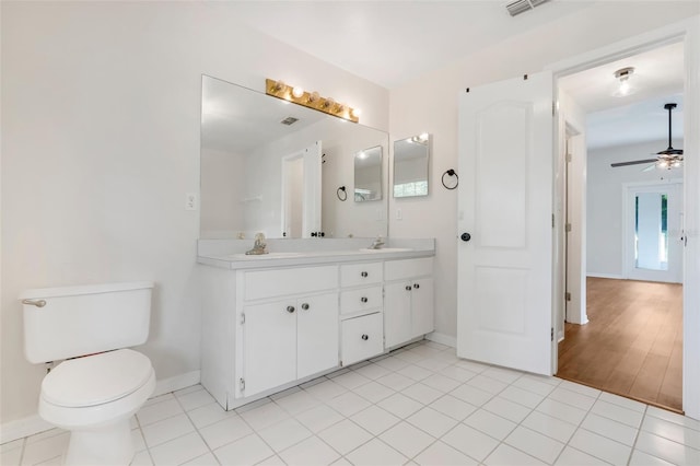 11442 Beggs Ct, Clermont, FL 34711 - bathroom with double vanity, ceiling fan, and tile patterned flooring