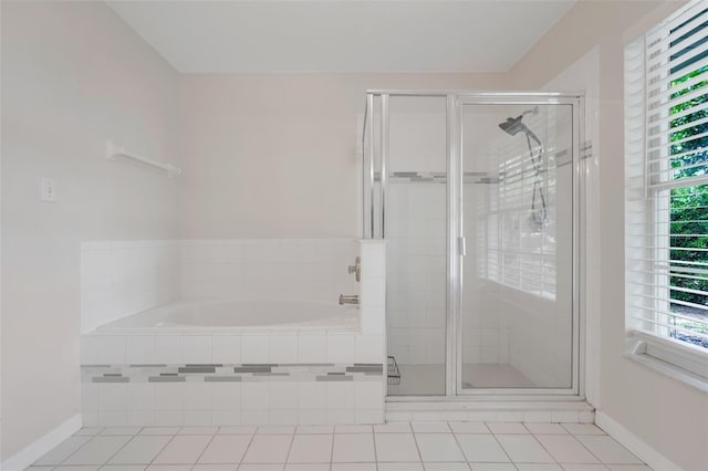 11442 Beggs Ct, Clermont, FL 34711 - full bath featuring a garden tub, a stall shower, and tile patterned floors