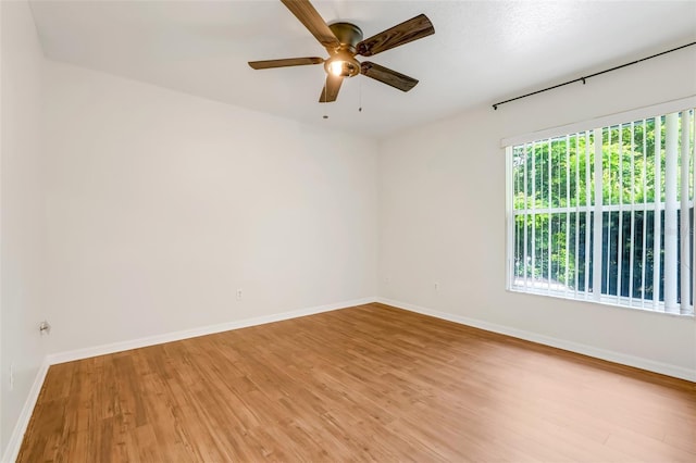 11442 Beggs Ct, Clermont, FL 34711 - unfurnished room with light wood-style floors and a ceiling fan