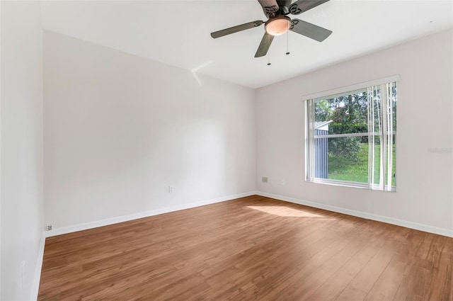 11442 Beggs Ct, Clermont, FL 34711 - spare room featuring wood finished floors and ceiling fan