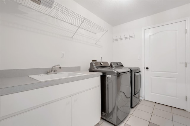 11442 Beggs Ct, Clermont, FL 34711 - laundry room featuring separate washer and dryer, light tile patterned floors, and cabinet space