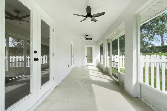 11442 Beggs Ct, Clermont, FL 34711 - unfurnished sunroom with ceiling fan, french doors, concrete flooring, and healthy amount of natural light
