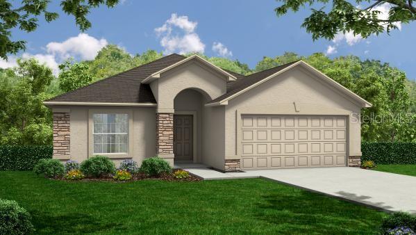 963 Lunar Ln, Winter Haven, FL 33884 - ranch-style house featuring stucco siding, a garage, stone siding, and a front yard