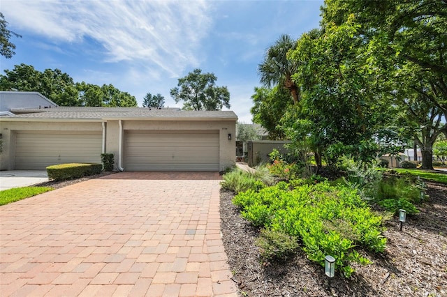 7755 High Pine Rd, Orlando, FL 32819 - garage featuring decorative driveway