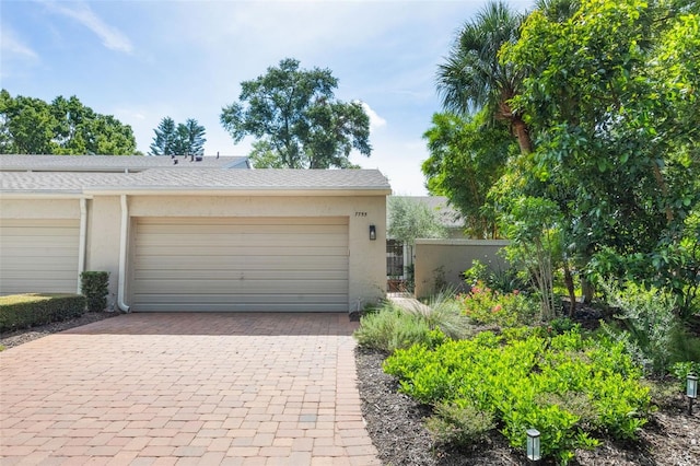 7755 High Pine Rd, Orlando, FL 32819 - garage with decorative driveway
